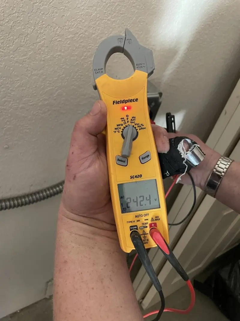 Voltage testing with clamp meter during Generator Installation in Cedar Mill